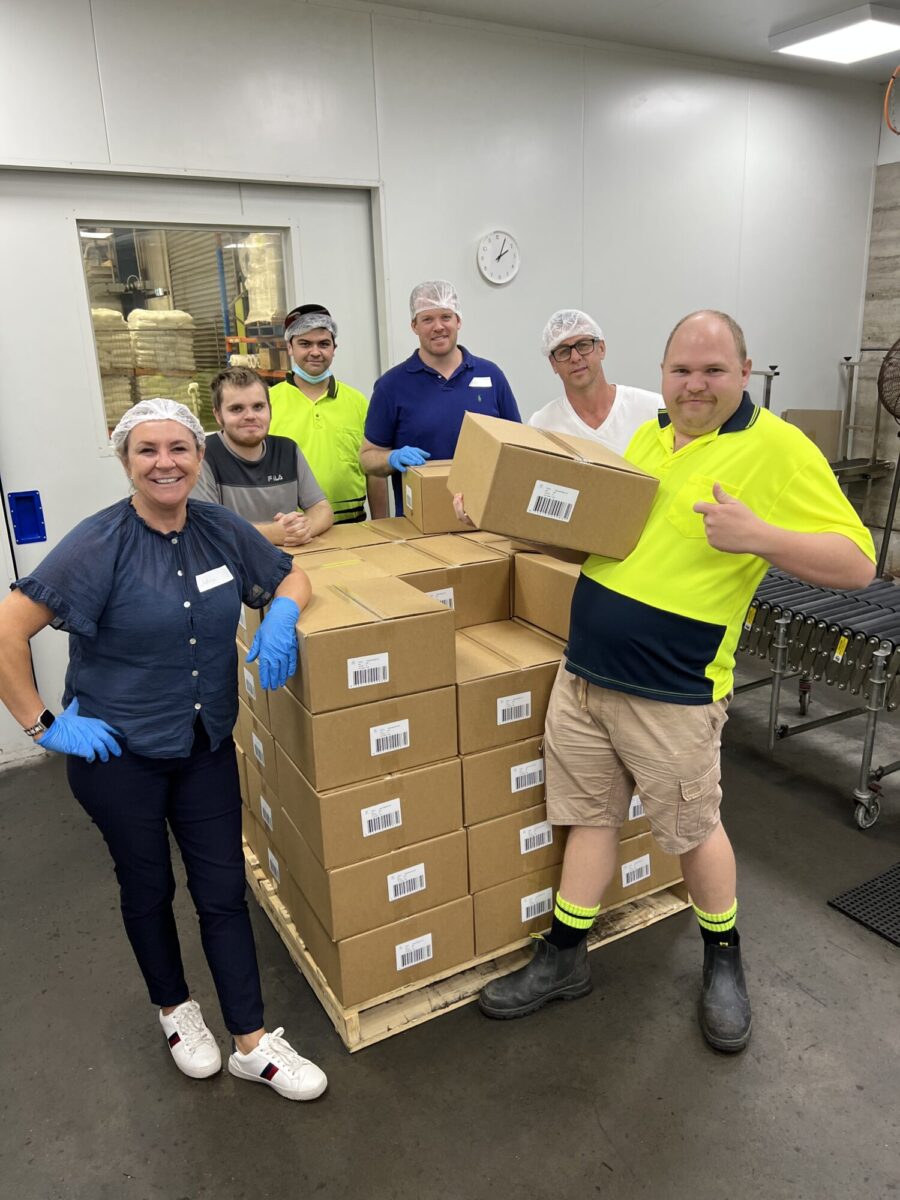 PAG staff volunteering to work alongside production line workers at Mt Druitt