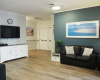 living room with railings on all walls and door