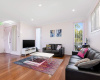 Living room - Main door - Couches - TV - windows